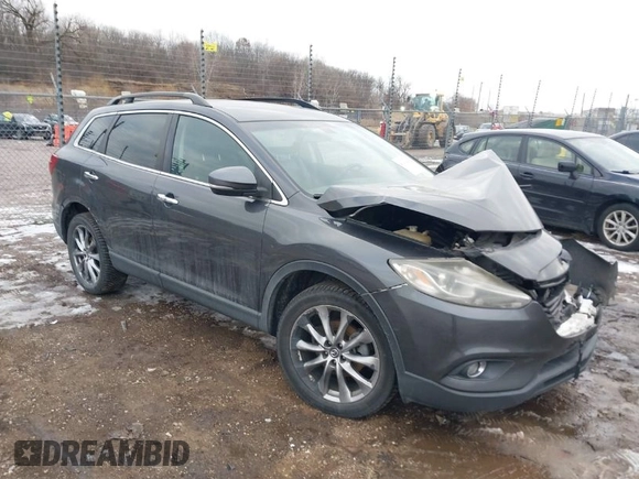 2015 Mazda CX-9 Grand Touring with VIN JM3TB2DAXF0447537, listed as a IAAI auction lot 41191694 with 157,113 mi miles. Bid and sale history available at carsss.com. Image 1.