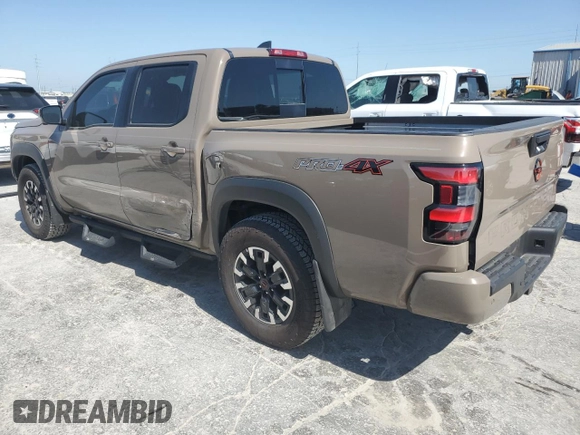 2023 Nissan Frontier Pro-4X with VIN 1N6ED1EK0PN668109, listed as a Copart auction lot 57064975 with 6,406 mi miles and Salvage title. Bid and sale history available at DreamBid. Image 2.