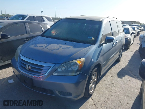 2009 Honda Odyssey EX-L with VIN 5FNRL38759B001130, listed as a IAAI auction lot 42004710 with 142,126 mi miles and . Bid and sale history available at DreamBid. Image 2.
