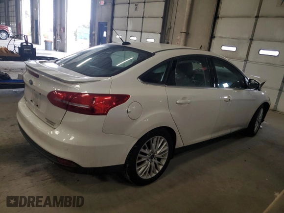 2015 Ford Focus Titanium с VIN 1FADP3J28FL385528, выставлен на аукционе Copart как лот 50628395 с пробегом 92 323 миль миль и На запчасти • Non repairable. История ставок и продаж доступна на DreamBid. Изображение 3.