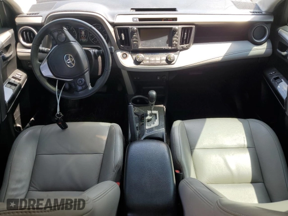 2018 Toyota RAV4 XLE with VIN 2T3WFREVXJW427748, listed as a Copart auction lot 61833055 with 104,057 mi miles and Salvage title. Bid and sale history available at DreamBid. Image 8.