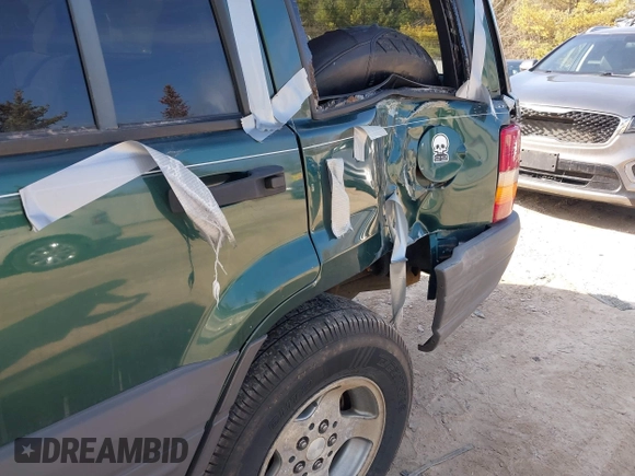 1997 Jeep Grand Cherokee Laredo with VIN 1J4GZ58S2VC595442, listed as a IAAI auction lot 41772133 with 229,764 mi miles. Bid and sale history available at carsss.com. Image 15.