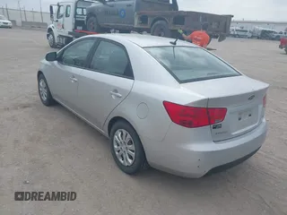 2012 Kia Forte EX with VIN KNAFU4A25C5591601, listed as a IAAI auction lot 42071351 with 120,636 mi miles. Bid and sale history available at carsss.com. Image 3.