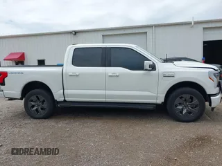 2022 Ford F-150 Lightning Pro with VIN 1FTVW1EL3NWG16132, listed as a IAAI auction lot 42362459 with 16,509 mi miles and . Bid and sale history available at DreamBid. Image 14.