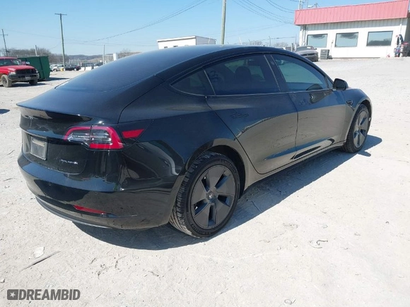 2022 Tesla Model 3 Long Range with VIN 5YJ3E1EB2NF174028, listed as a IAAI auction lot 41697310 with NaN miles. Bid and sale history available at carsss.com. Image 4.