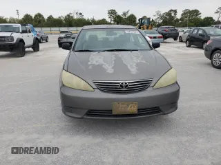 2006 Toyota Camry STD z VIN 4T1BE32K36U699650, wystawiony jako Copart lot #61942095 z przebiegiem 194 810 mil mil oraz Czysty tytuł • Clean title. Historia ofert i sprzedaży dostępna na DreamBid. Obrazek 5.