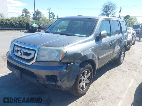 2010 Honda Pilot Touring with VIN 5FNYF4H94AB031167, listed as a IAAI auction lot 41800738 with 184,126 mi miles and . Bid and sale history available at carsss.com. Image 6.