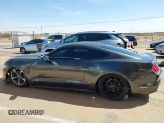 2015 Ford Mustang V6 with VIN 1FA6P8AM5F5318400, listed as a IAAI auction lot 41812625 with 97,728 mi miles and . Bid and sale history available at DreamBid. Image 14.