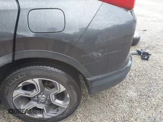 2018 Honda CR-V EX z VIN 7FARW2H50JE094132, wystawiony jako IAAI lot #42337889 z przebiegiem 59 273 mil mil oraz . Historia ofert i sprzedaży dostępna na DreamBid. Obrazek 20.