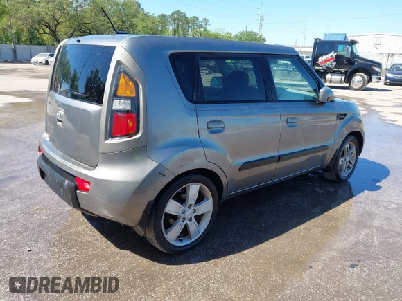 2010 Kia Soul + with VIN KNDJT2A29A7028640, listed as a IAAI auction lot 41820532 with 303,975 mi miles. Bid and sale history available at carsss.com. Image 4.