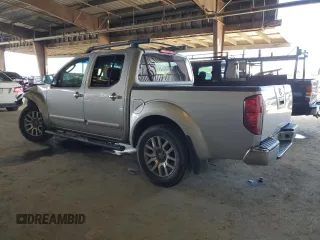 2009 Nissan Frontier SE with VIN 1N6AD07U69C403815, listed as a Copart auction lot 49161015 with 181,843 mi miles and Salvage title. Bid and sale history available at DreamBid. Image 2.