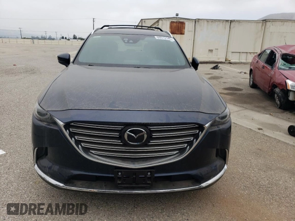 2017 Mazda CX-9 Grand Touring z VIN JM3TCADY3H0140573, wystawiony jako Copart lot #60513145 z przebiegiem 97 793 mil mil oraz Czysty tytuł • Clean title. Historia ofert i sprzedaży dostępna na DreamBid. Obrazek 5.