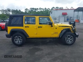 2015 Jeep Wrangler Unlimited Willys Wheeler with VIN 1C4BJWDG2FL643375, listed as a IAAI auction lot 42109724 with 112,357 mi miles and . Bid and sale history available at DreamBid. Image 13.