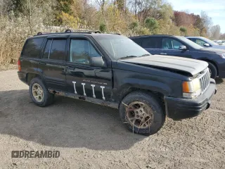 1998 Jeep Grand Cherokee Laredo with VIN 1J4GZ48YXWC299827, listed as a Copart auction lot 76898264 with 232,656 mi miles and Clean Title. Bid and sale history available at carsss.com. Image 4.