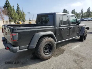 2020 Jeep Gladiator Rubicon z VIN 1C6JJTBG7LL197837, wystawiony jako Copart lot #58169095 z przebiegiem 59 578 mil mil oraz Szkoda całkowita • Salvage title. Historia ofert i sprzedaży dostępna na DreamBid. Obrazek 3.