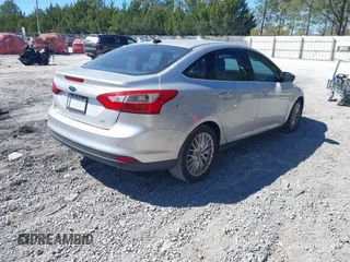 2012 Ford Focus SEL with VIN 1FAHP3H29CL114884, listed as a IAAI auction lot 41785864 with 180,095 mi miles. Bid and sale history available at carsss.com. Image 4.