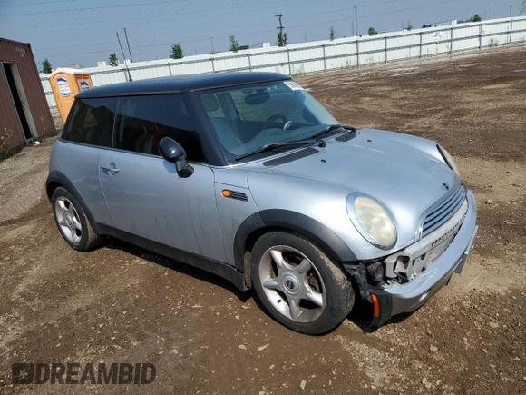 2004 MINI Hardtop with VIN WMWRC33454TJ56308, listed as a Copart auction lot 59690865 with 99,374 mi miles and Salvage title. Bid and sale history available at DreamBid. Image 4.