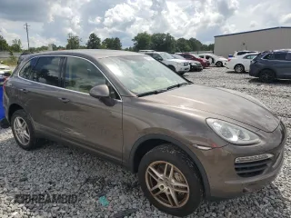 2014 Porsche Cayenne S Hybrid with VIN WP1AE2A29ELA51406, listed as a Copart auction lot 61163965 with 99,047 mi miles and Clean title. Bid and sale history available at DreamBid. Image 4.