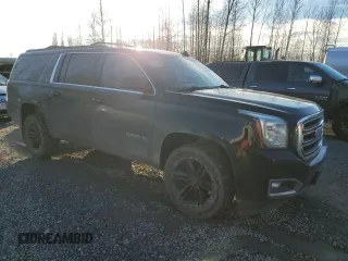 2015 GMC Yukon XL SLT with VIN 1GKS2HKC4FR697416, listed as a Copart auction lot 87887925 with 236,772 mi miles and Salvage Title. Bid and sale history available at carsss.com. Image 4.