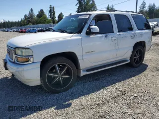 2005 GMC Yukon Denali z VIN 1GKEK63U55J143324, wystawiony jako Copart lot #59000695 z przebiegiem Nie podano mil oraz Szkoda całkowita • Salvage title. Historia ofert i sprzedaży dostępna na DreamBid. Obrazek 1.