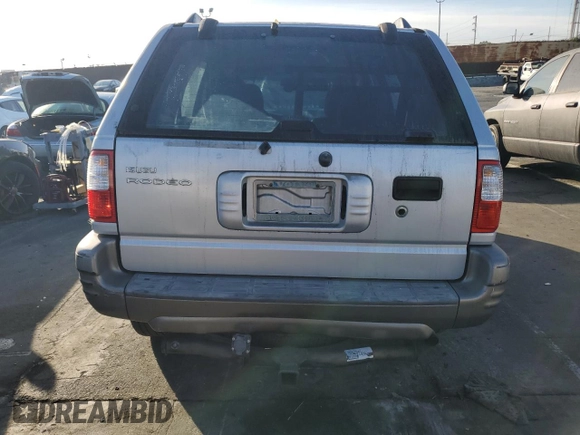 2000 Isuzu Rodeo S z VIN 4S2CK58W2Y4311726, wystawiony jako Copart lot #85070364 z przebiegiem 226 510 mil mil oraz Szkody całkowita. Historia ofert i sprzedaży dostępna na DreamBid. Obrazek 6.