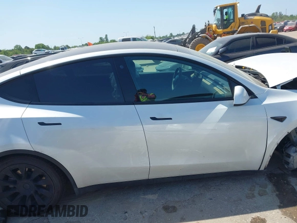 2021 Tesla Model Y Long Range with VIN 5YJYGDEE0MF265339, listed as a IAAI auction lot 41975058 with 51,292 mi miles and . Bid and sale history available at DreamBid. Image 13.