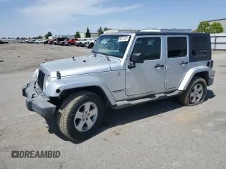 2007 Jeep Wrangler Unlimited Sahara with VIN 1J8GA59137L181360, listed as a Copart auction lot 62311225 with 151,393 mi miles and Salvage title. Bid and sale history available at DreamBid. Image 1.