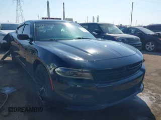 2019 Dodge Charger SXT with VIN 2C3CDXBG9KH580890, listed as a IAAI auction lot 41793008 with 52,497 mi miles. Bid and sale history available at carsss.com. Image 1.