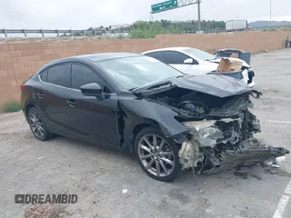 2018 Mazda 3 Touring with VIN 3MZBN1V30JM201671, listed as a IAAI auction lot 42189105 with 174,284 mi miles. Bid and sale history available at carsss.com. Image 1.