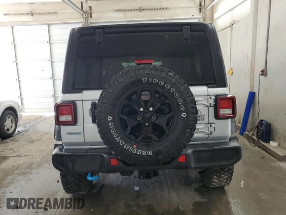 2023 Jeep Wrangler z VIN 1C4JJXN64PW630179, wystawiony jako Copart lot #44457744 z przebiegiem 27 905 mil mil oraz Czysty tytuł • Clean title. Historia ofert i sprzedaży dostępna na DreamBid. Obrazek 6.