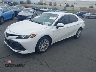 2020 Toyota Camry LE with VIN 4T1C11AK3LU882824, listed as a IAAI auction lot 41765544 with 48,209 mi miles and . Bid and sale history available at carsss.com. Image 2.