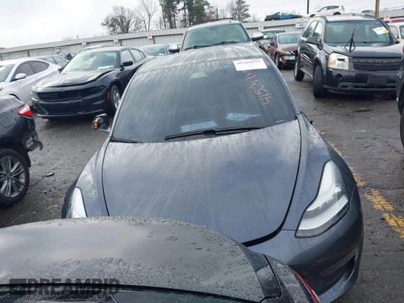 2019 Tesla Model 3 Mid Range with VIN 5YJ3E1EA3KF426971, listed as a IAAI auction lot 41564939 with Not Provided miles and . Bid and sale history available at carsss.com. Image 12.