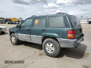 1993 Jeep Grand Cherokee Laredo with VIN 1J4GZ58Y8PC513026, listed as a Copart auction lot 57001465 with 135,242 mi miles and Clean title. Bid and sale history available at DreamBid. Image 2.
