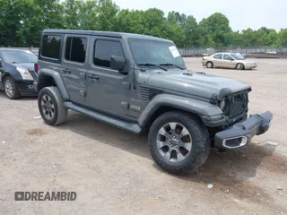 2018 Jeep Wrangler Unlimited Sahara z VIN 1C4HJXEN1JW320942, wystawiony jako IAAI lot #42471093 z przebiegiem 116 907 mil mil oraz . Historia ofert i sprzedaży dostępna na DreamBid. Obrazek 1.
