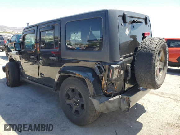 2015 Jeep Wrangler Unlimited Freedom with VIN 1C4HJWDG0FL598947, listed as a Copart auction lot 61794214 with 125,778 mi miles and Salvage title. Bid and sale history available at DreamBid. Image 2.