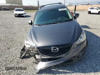 2014 Mazda CX-5 Touring with VIN JM3KE4CY6E0375084, listed as a Copart auction lot 46344065 with 143,828 mi miles and Salvage Title. Bid and sale history available at carsss.com. Image 5.