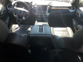 2015 GMC Yukon Denali with VIN 1GKS2CKJ5FR612147, listed as a Copart auction lot 49209525 with 127,262 mi miles and Salvage Title. Bid and sale history available at carsss.com. Image 8.
