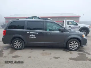 2019 Dodge Grand Caravan SXT with VIN 2C4RDGCGXKR723991, listed as a IAAI auction lot 40670679 with 174,387 mi miles and . Bid and sale history available at DreamBid. Image 13.