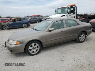 2002 Mazda 626 LX z VIN 1YVGF22D225285499, wystawiony jako Copart lot #53693055 z przebiegiem 144 812 mil mil oraz Szkoda całkowita • Salvage title. Historia ofert i sprzedaży dostępna na DreamBid. Obrazek 1.