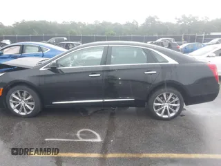 2013 Cadillac XTS Premium z VIN 2G61S5S39D9112491, wystawiony jako IAAI lot #42216373 z przebiegiem 145 338 mil mil oraz . Historia ofert i sprzedaży dostępna na DreamBid. Obrazek 14.
