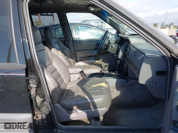 1995 Jeep Grand Cherokee Laredo z VIN 1J4GZ58S9SC553345, wystawiony jako IAAI lot #42772979 z przebiegiem 216 808 mil mil oraz . Historia ofert i sprzedaży dostępna na DreamBid. Obrazek 5.