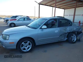 2003 Hyundai Elantra GLS z VIN KMHDN45D43U552485, wystawiony jako IAAI lot #41680449 z przebiegiem 127 899 mil mil oraz . Historia ofert i sprzedaży dostępna na DreamBid. Obrazek 14.