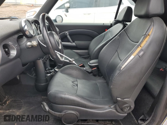 2007 MINI Convertible with VIN WMWRF33597TG16707, listed as a Copart auction lot 79104014 with 113,380 mi miles and Salvage Title. Bid and sale history available at DreamBid. Image 7.