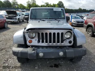 2013 Jeep Wrangler Unlimited Sport with VIN 1C4BJWDG1DL601972, listed as a Copart auction lot 65069824 with 166,274 mi miles and Salvage Title. Bid and sale history available at carsss.com. Image 5.