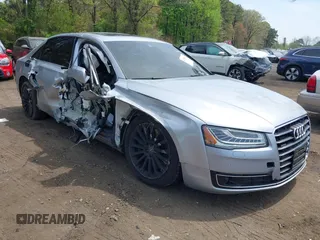 2015 Audi A8 4.0T z VIN WAU32AFD2FN038880, wystawiony jako IAAI lot #42138932 z przebiegiem 102 968 mil mil oraz . Historia ofert i sprzedaży dostępna na DreamBid. Obrazek 1.