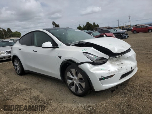 2023 Tesla Model Y Long Range z VIN 7SAYGAEE0PF693613, wystawiony jako Copart lot #54452895 z przebiegiem 19 574 mil mil oraz Szkoda całkowita • Salvage title. Historia ofert i sprzedaży dostępna na DreamBid. Obrazek 4.