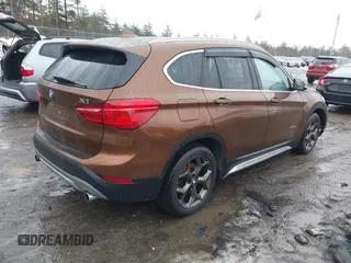 2016 BMW X1 xDrive28i with VIN WBXHT3C31GP881488, listed as a IAAI auction lot 41693116 with 120,922 mi miles. Bid and sale history available at carsss.com. Image 4.