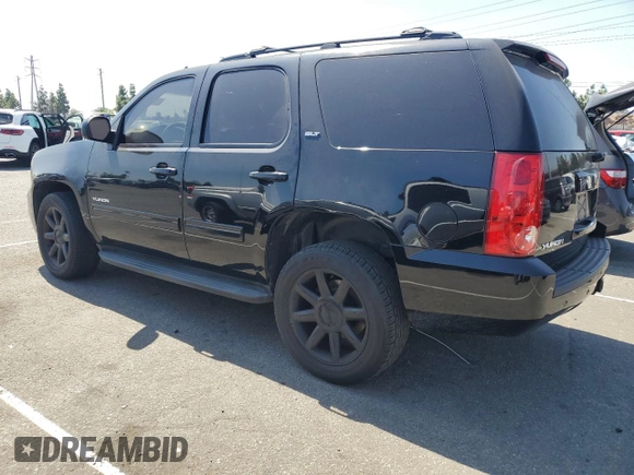 2013 GMC Yukon SLT with VIN 1GKS1CE06DR162852, listed as a Copart auction lot 71586174 with 182,169 mi miles and Salvage Title. Bid and sale history available at carsss.com. Image 2.