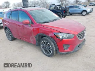 2016 Mazda CX-5 Grand Touring with VIN JM3KE4DY8G0729446, listed as a IAAI auction lot 41871207 with 89,258 mi miles. Bid and sale history available at carsss.com. Image 1.