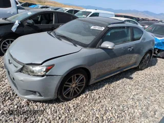 2012 Scion tC z VIN JTKJF5C79C3023507, wystawiony jako Copart lot #56819635 z przebiegiem 144 139 mil mil oraz Szkoda całkowita • Salvage title. Historia ofert i sprzedaży dostępna na DreamBid. Obrazek 1.